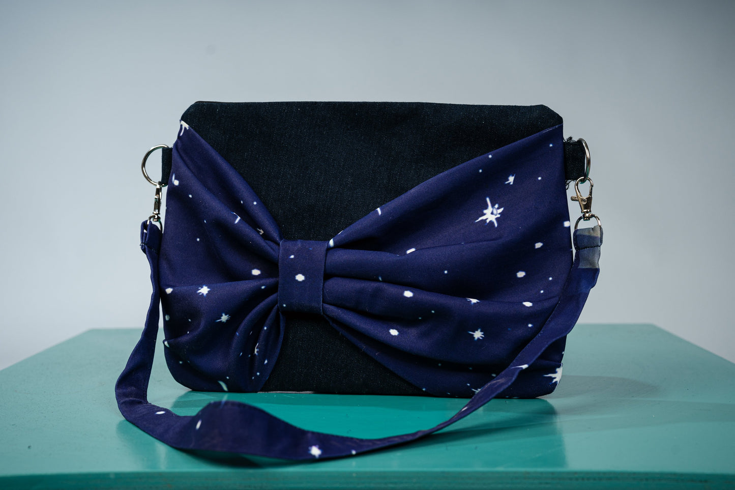 wings of grace bow clutch