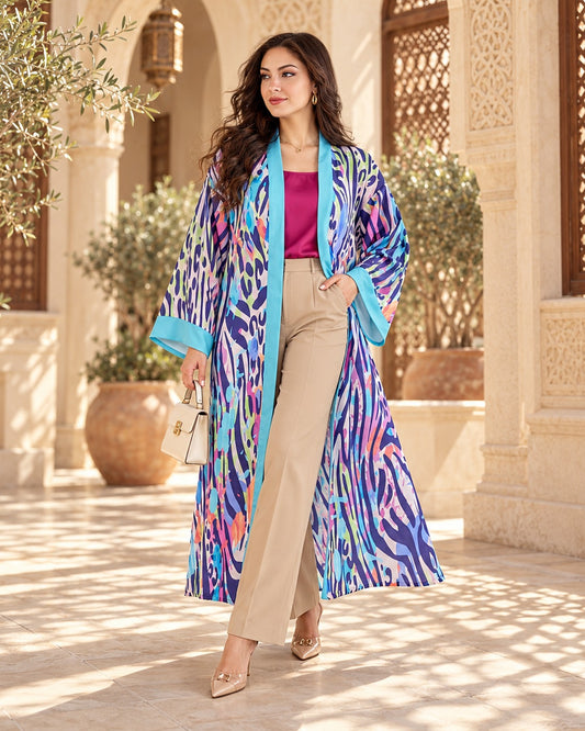 Zebratastic long cardigan in multicolor zebra print with turquoise trim, worn with beige trousers